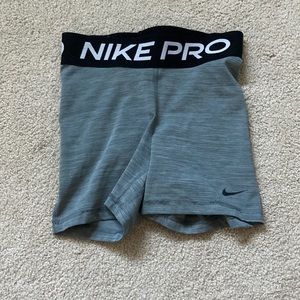 Grey black and white Nike pros